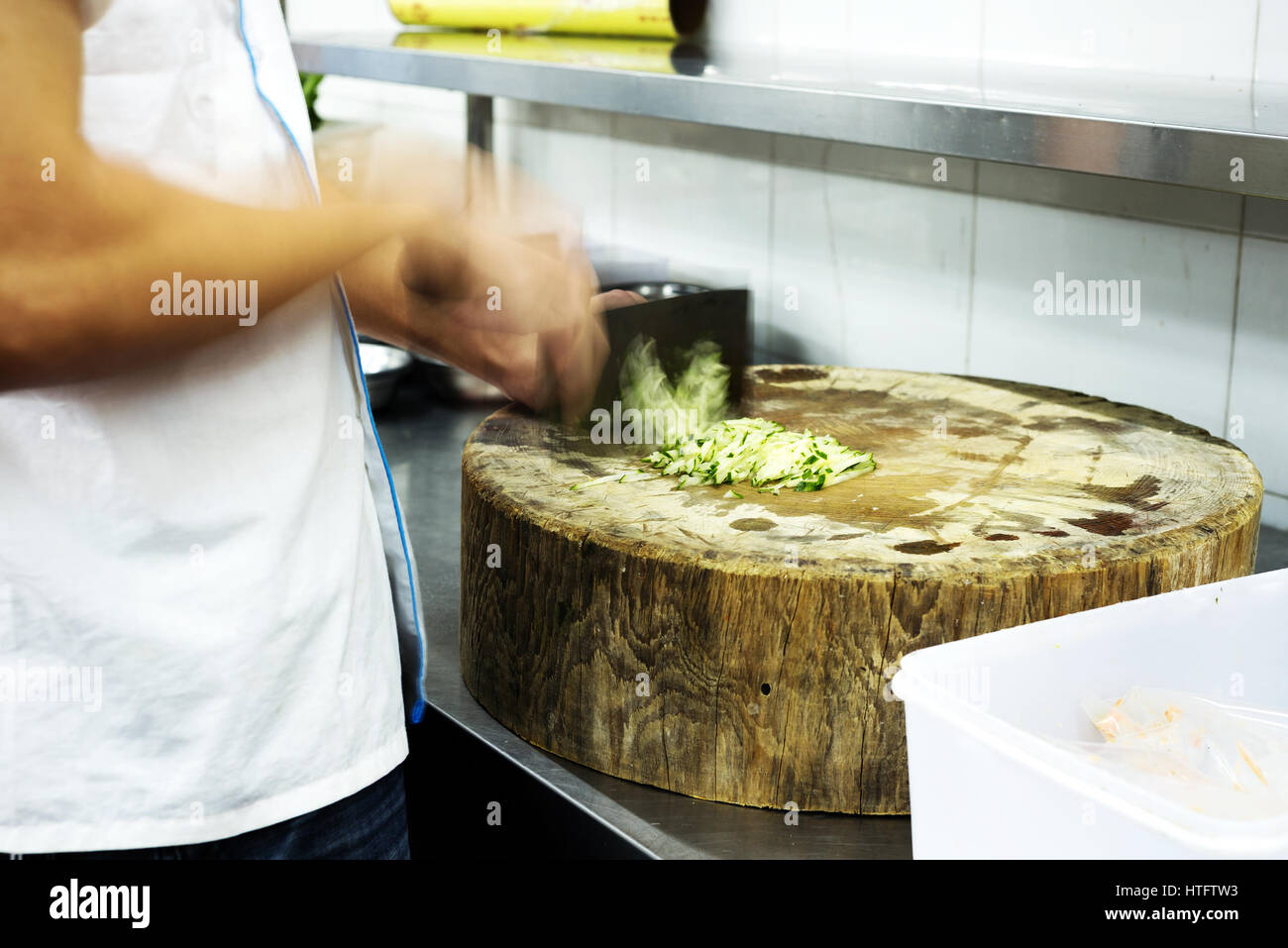 Chinese chef is cutting cucumber Stock Photo