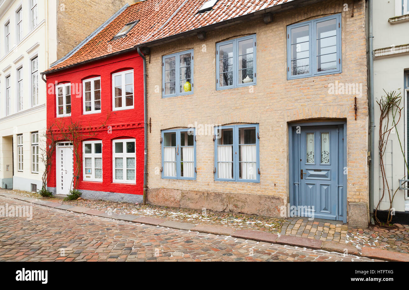 Traditional colorful living houses stand along street in old town of