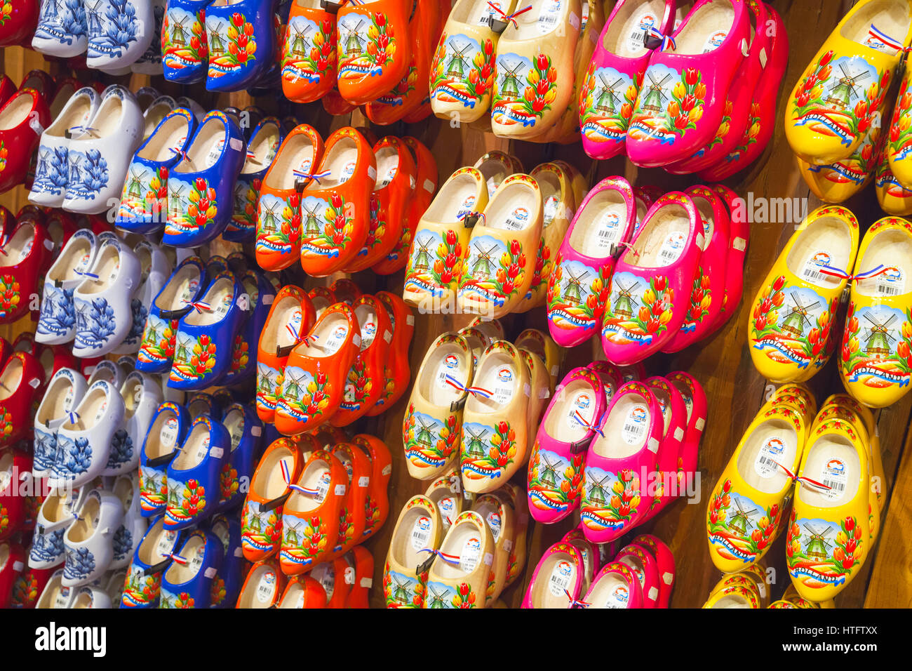 Zaanse Schans, Netherlands - February 25: Colorful Dutch clogs made of poplar wood, traditional shoes with paintings stand on gift shop counter Stock Photo
