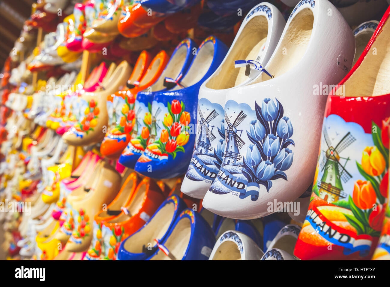 Zaanse Schans, Netherlands - February 25: Colorful Dutch clogs made of poplar wood, traditional shoes with paintings stand on souvenir shop counter Stock Photo