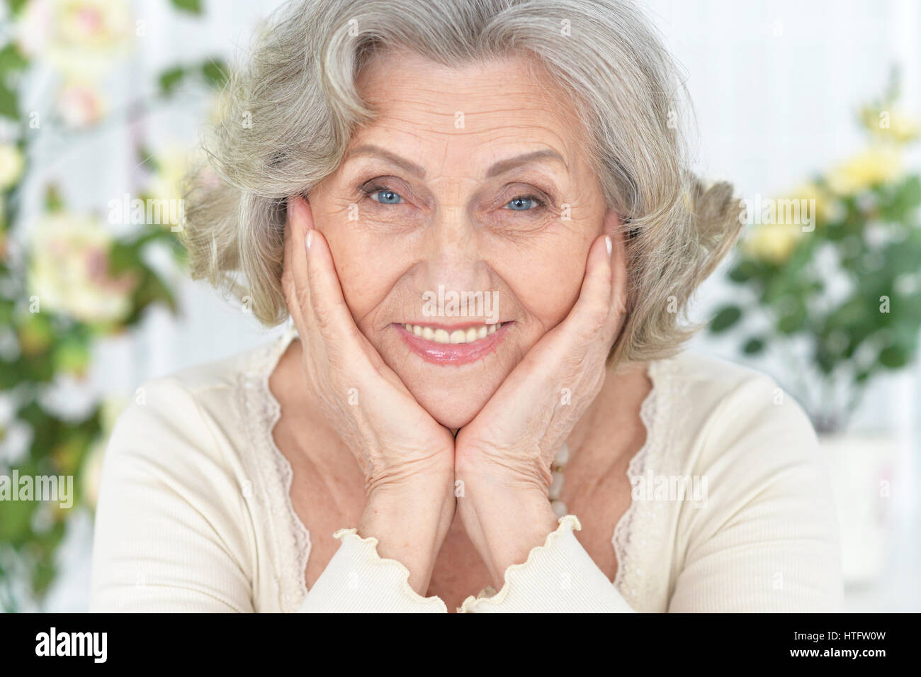 Portrait of a beautiful happy elderly woman closeup Stock Photo - Alamy