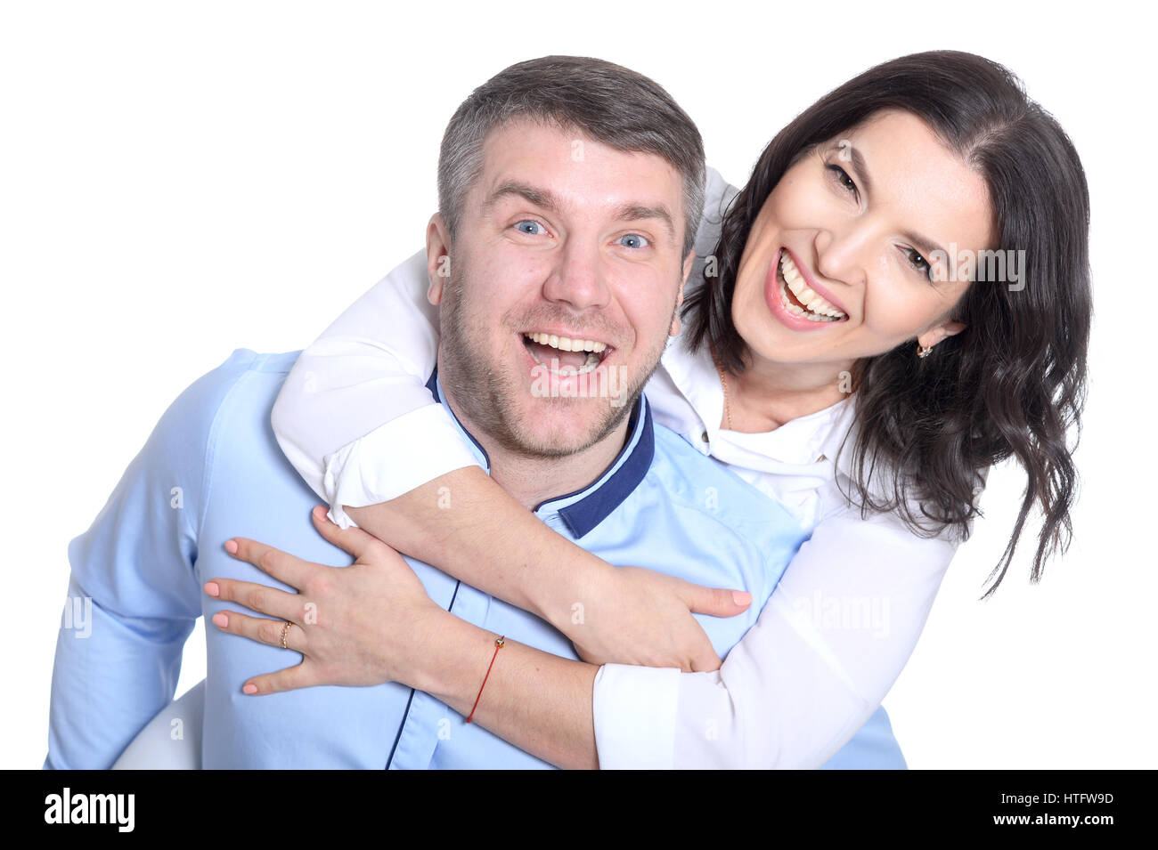Portrait of a happy young couple on a white background Stock Photo - Alamy