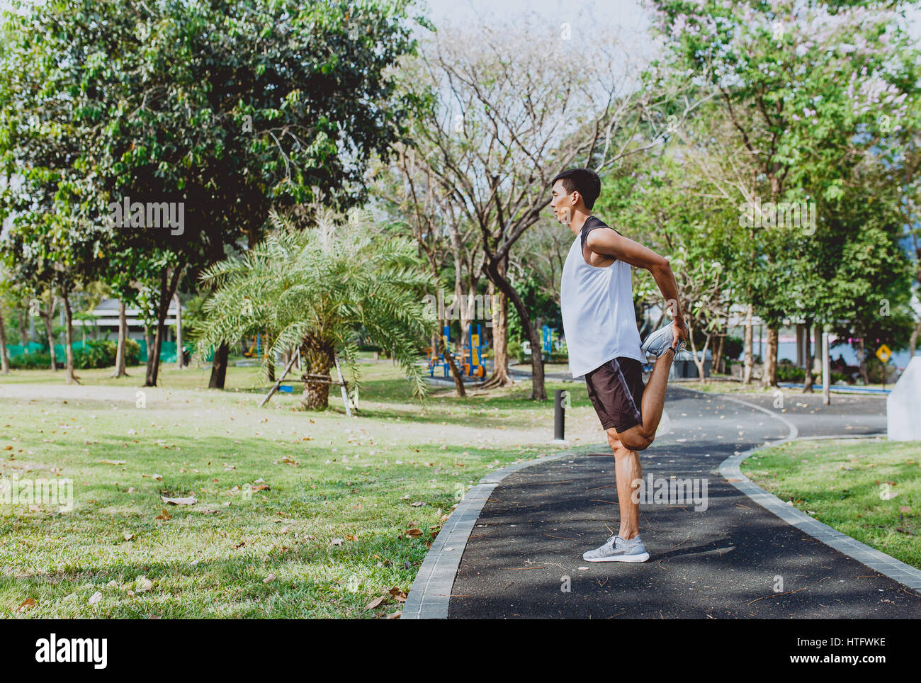 Asian man stretching muscles hi-res stock photography and images - Alamy