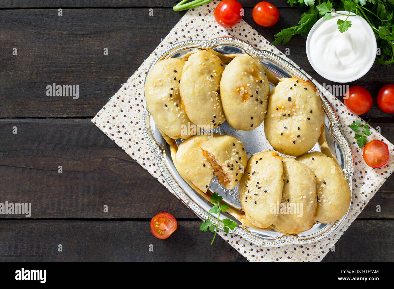 Potato zrazy. Baked pies from potato dough with cabbage are served with