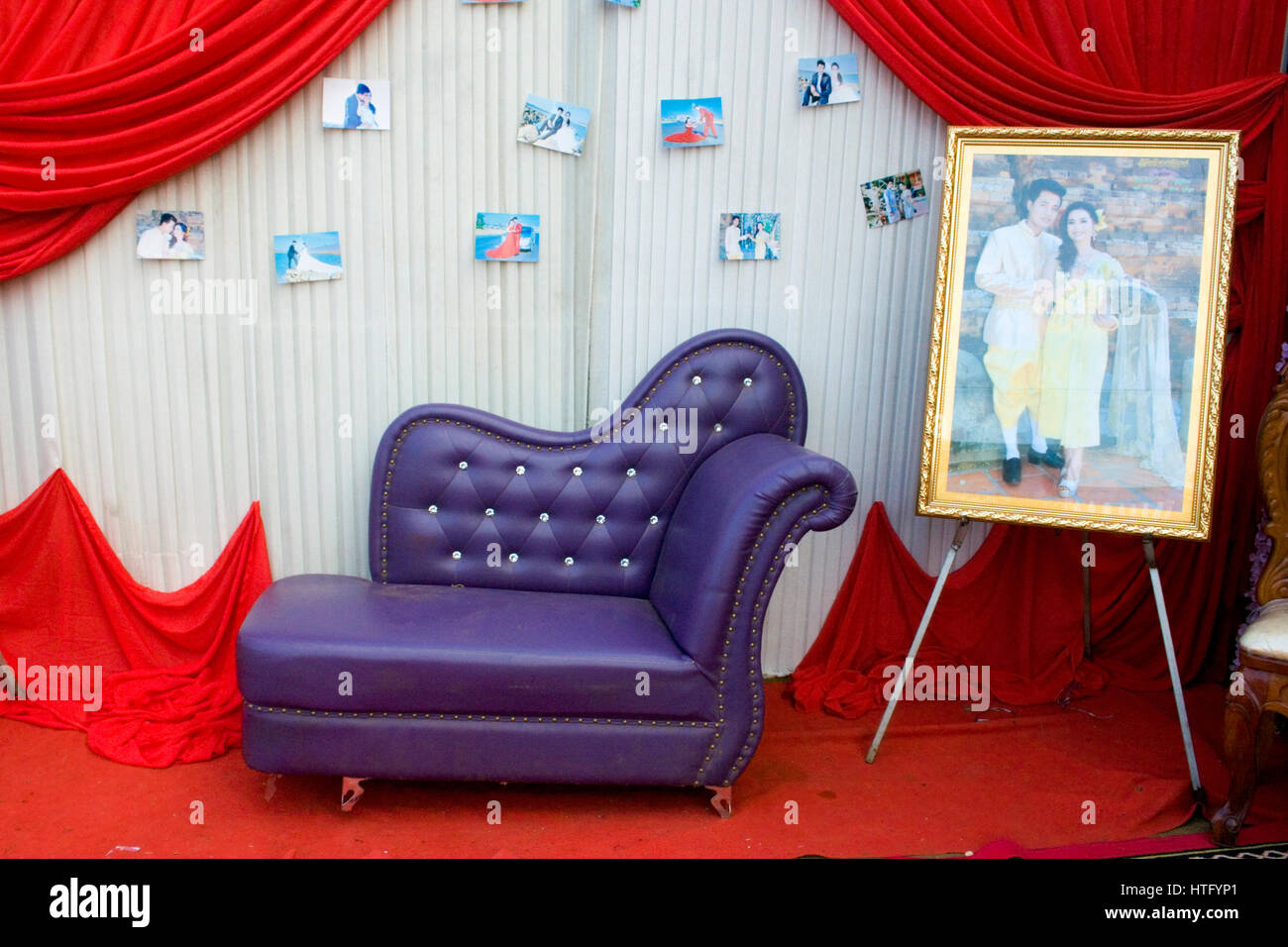 Small Wedding Photographs Are Attached To A Wall Behind A Purple