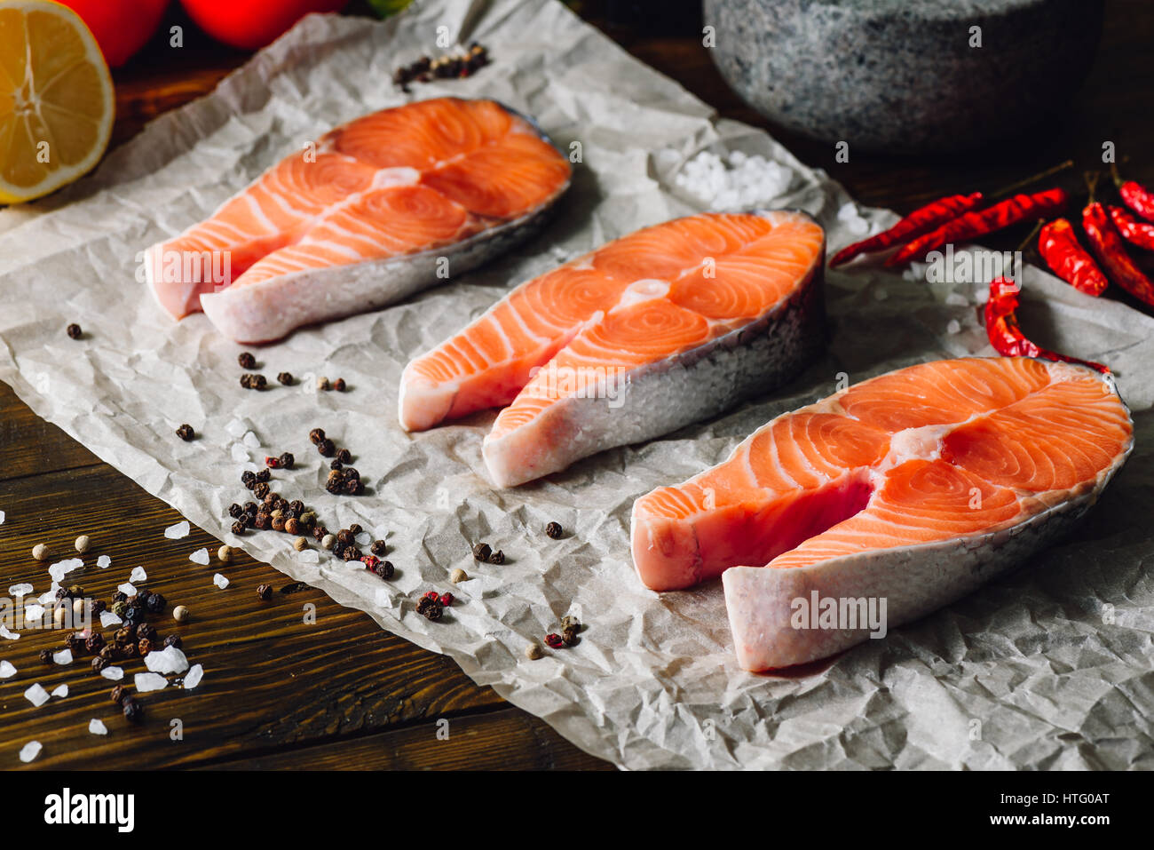 Three Raw Salmon Steaks with Some Spices Stock Photo - Alamy