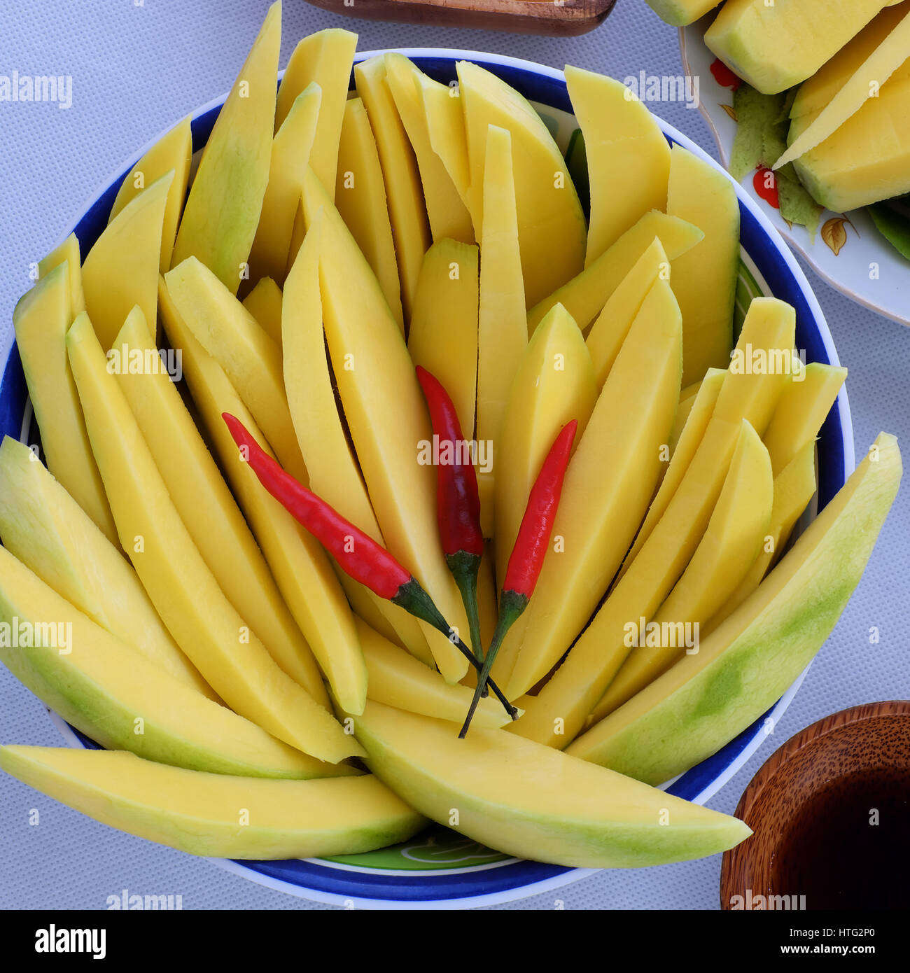 Vietnamese fruit, green mango cut in slice, a popular tropical fruit, rich  vitamin A, vitamin C, collagen, good for health, impulse calcium absorption  Stock Photo - Alamy