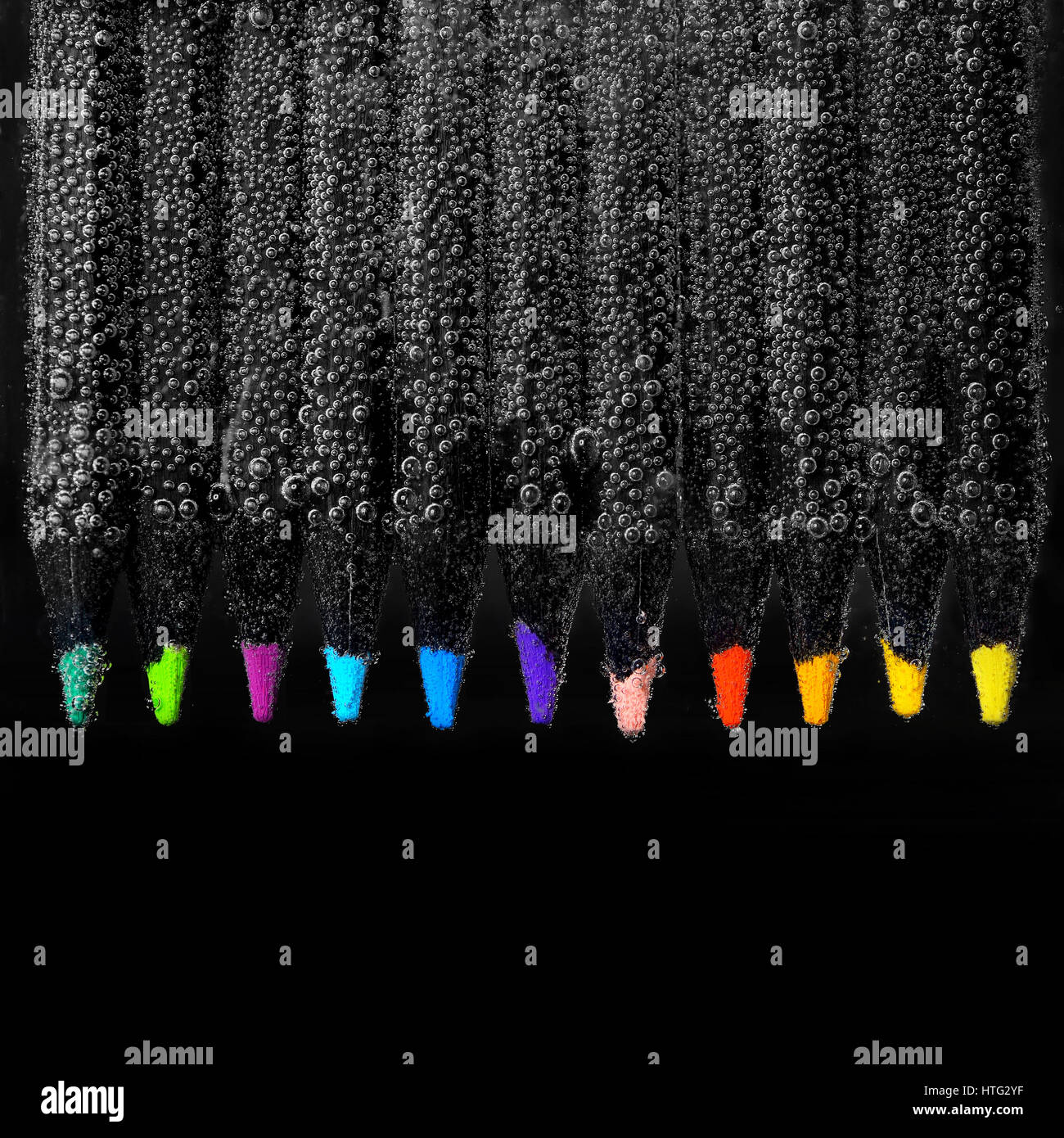 Set of colored pencils and bubbles on black background Stock Photo Alamy