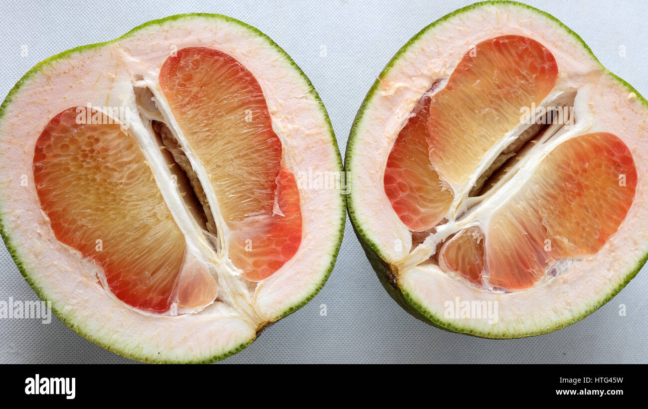 Grapefruit on white background, tropical fruit, rich vitamin A, healthy