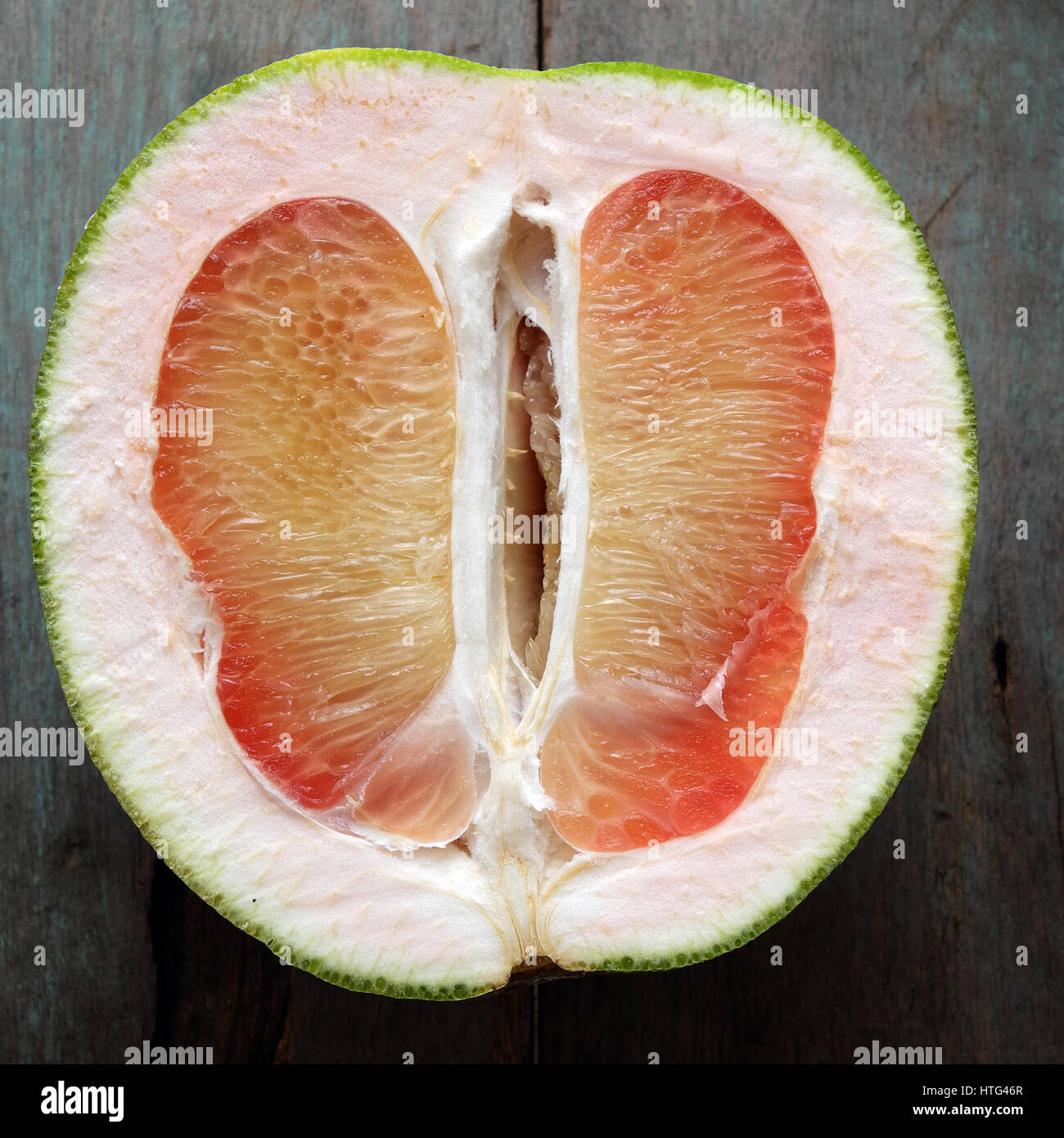 Grapefruit on wood background, tropical fruit, rich vitamin A, healthy eating, reduce