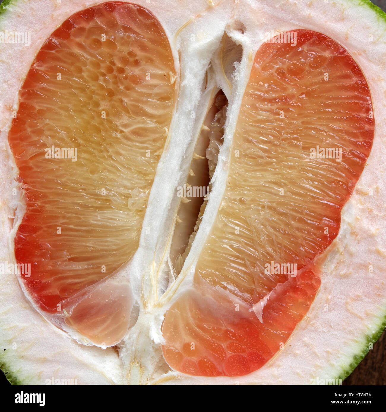 Grapefruit on wood background, tropical fruit, rich vitamin A, healthy