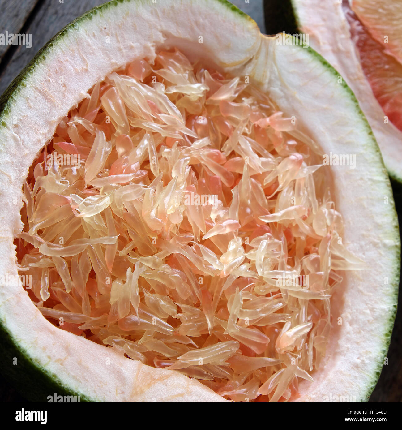 Grapefruit on wood background, tropical fruit, rich vitamin A, healthy