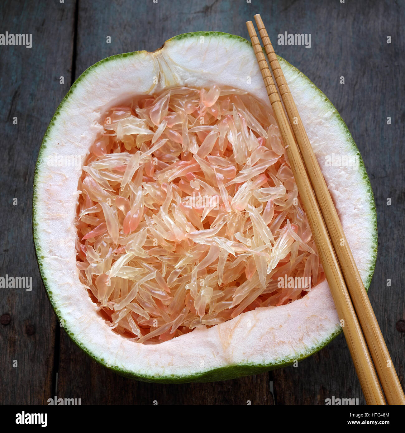 Grapefruit on wood background, tropical fruit, rich vitamin A, healthy
