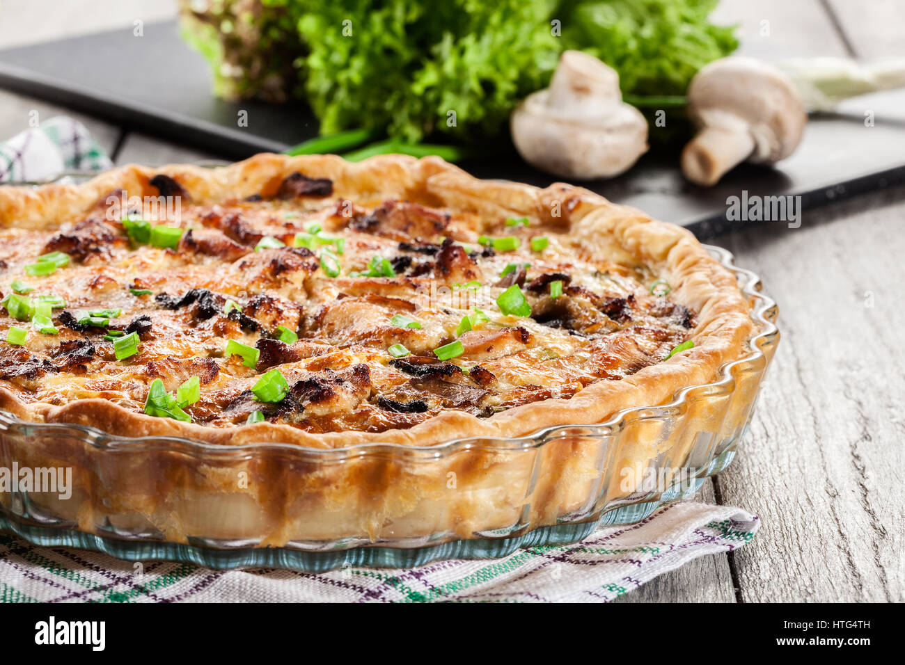 Savory tart with chicken, mushrooms and cheese Stock Photo