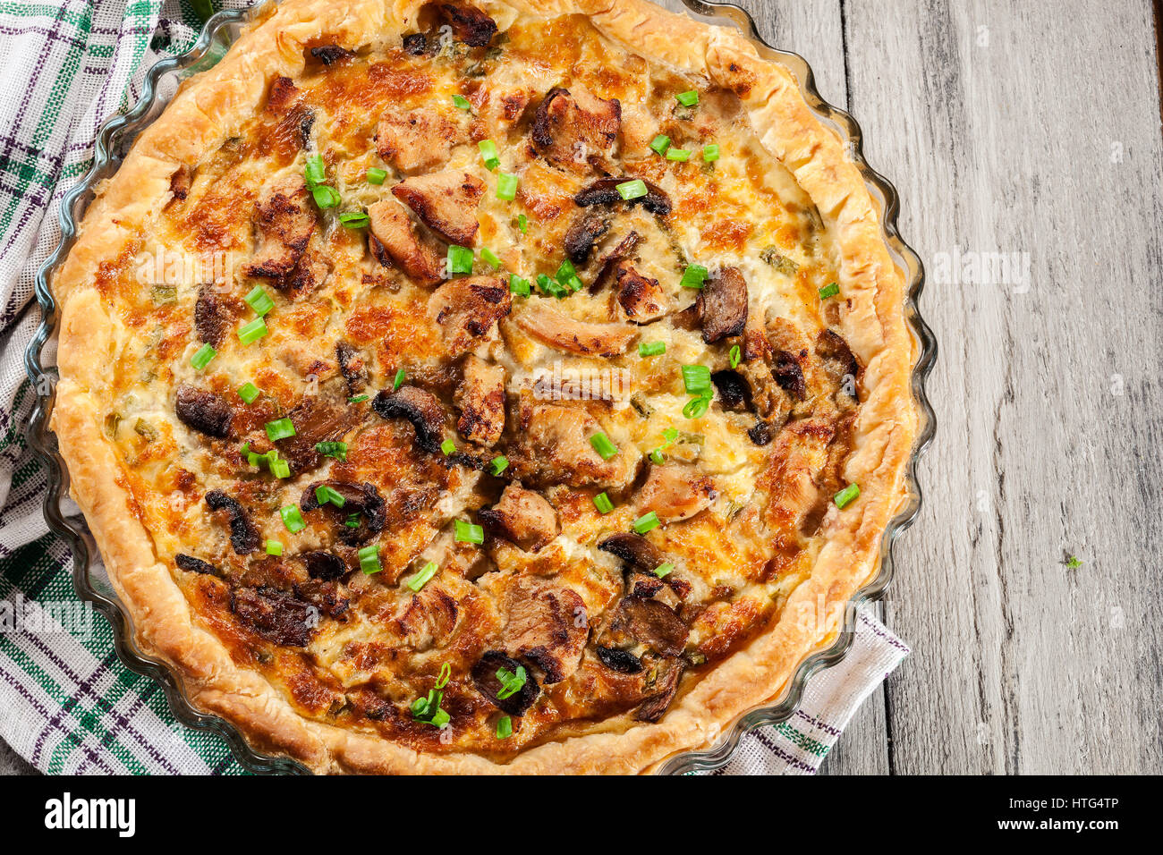 Savory tart with chicken, mushrooms and cheese Stock Photo