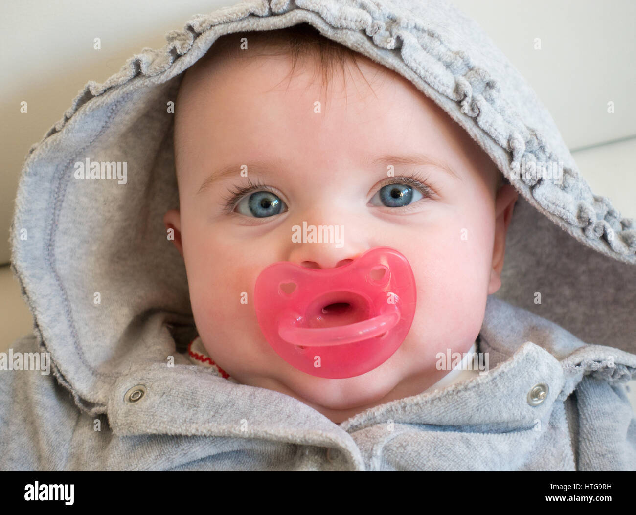 Portrait of baby girl with blue eyes. Stock Photo