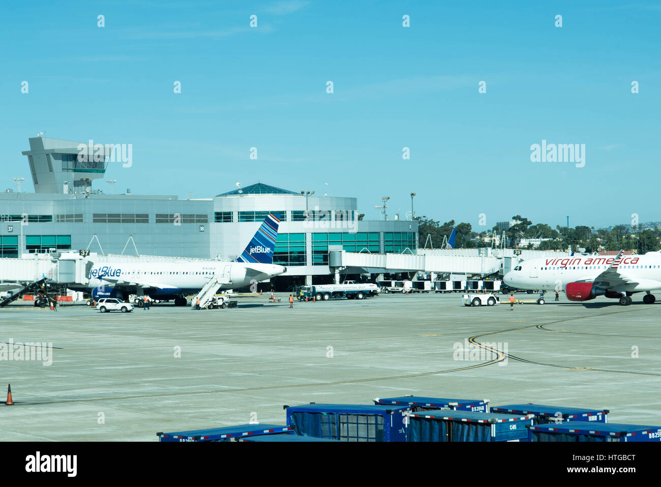 Airplanes on the ramp at San Antonio airport and control tower in ...