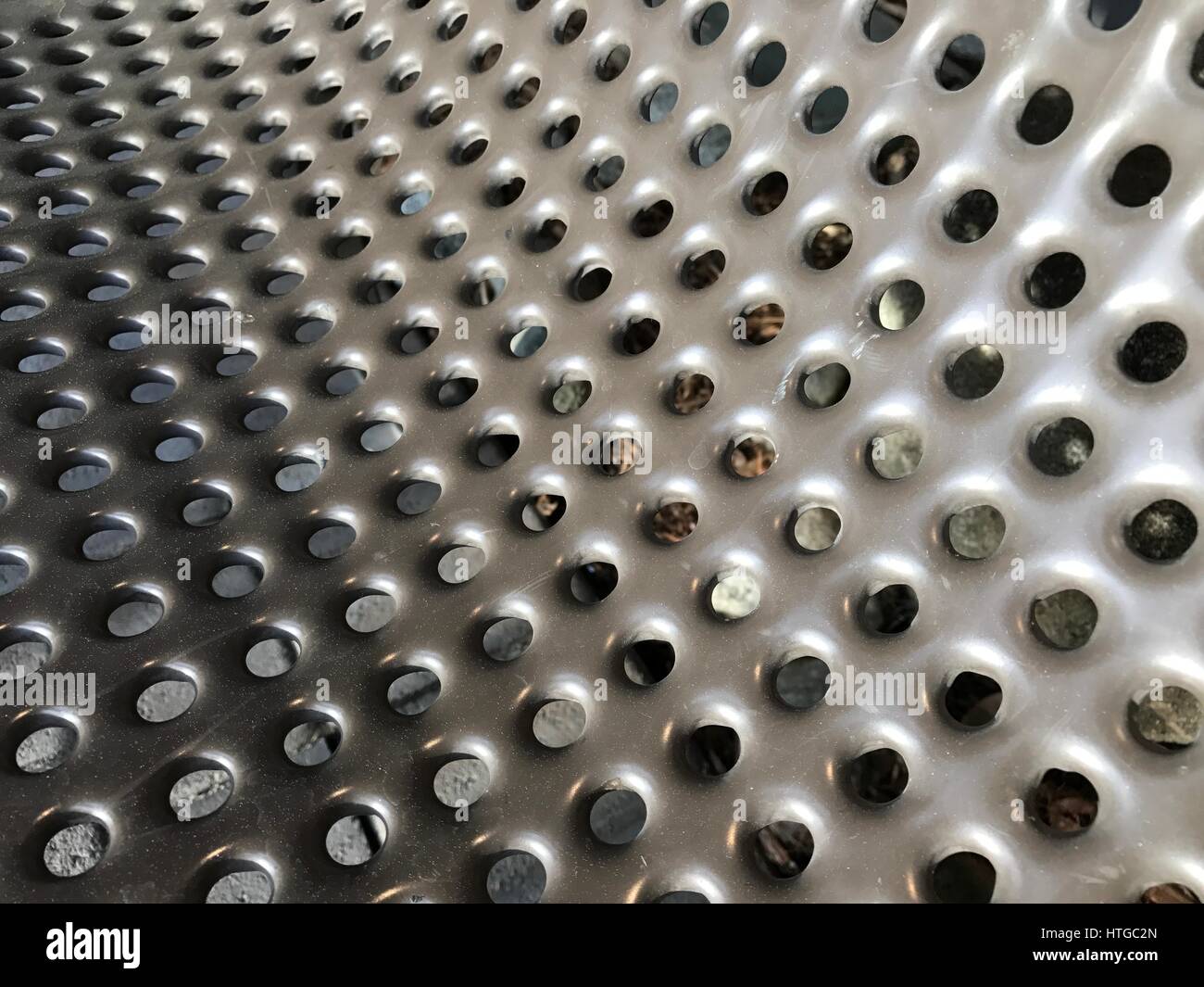 Steel plates with holes for texture. Background Stock Photo Alamy
