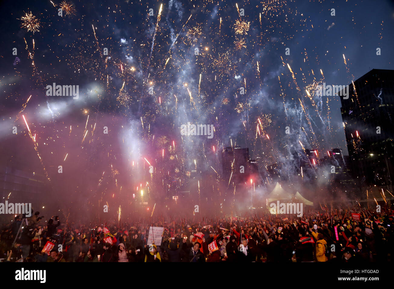 Seoul, South Korea. 11th Mar, 2017. South Koreans set off fireworks to celebrate the impeachment of President Park Guen-Hye on the Gwanghwamun square. Credit: Min Won-Ki/ZUMA Wire/Alamy Live News Stock Photo