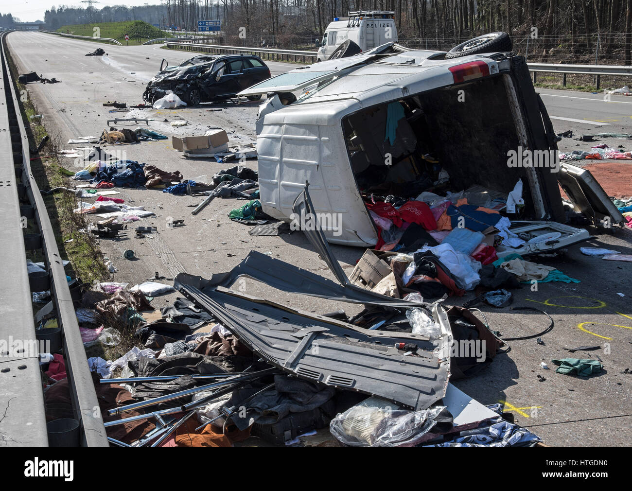 Cloppenburg, Germany. 11th Mar, 2017. The scene of a multi-car pile-up on the A1 motorway near Cloppenburg, Germany, 11 March 2017. A white van tipped onto its side after colliding with a truck and sliding onto the passing lane before being rammed by a black station wagon. The driver of the car as well as the two passengers in the van died at the scene. Photo: Ingo Wagner/dpa/Alamy Live News Stock Photo