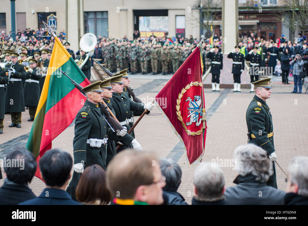 Vilnius, Lithuania. 11th Mar, 2017. Lithuanian Army Man Carry the Coat of Arms and Flag of Lithuania at the Independence Day Ceremony in Vilnius. Credit: Aleksandr Lukjanov/Alamy Live News Stock Photo