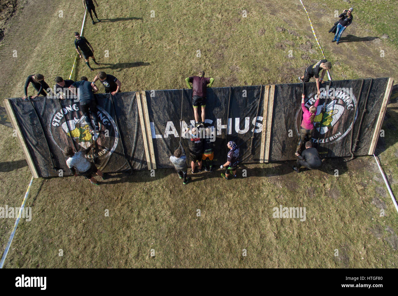 Fuerstenau, Germany. 11th Mar, 2017. Participants in the Strong Viking Run obstacle course race in Fuerstenau, Germany, 11 March 2017. The participants must complete a race over numerous artificial and natural obstacles. Photo: Friso Gentsch/dpa/Alamy Live News Stock Photo