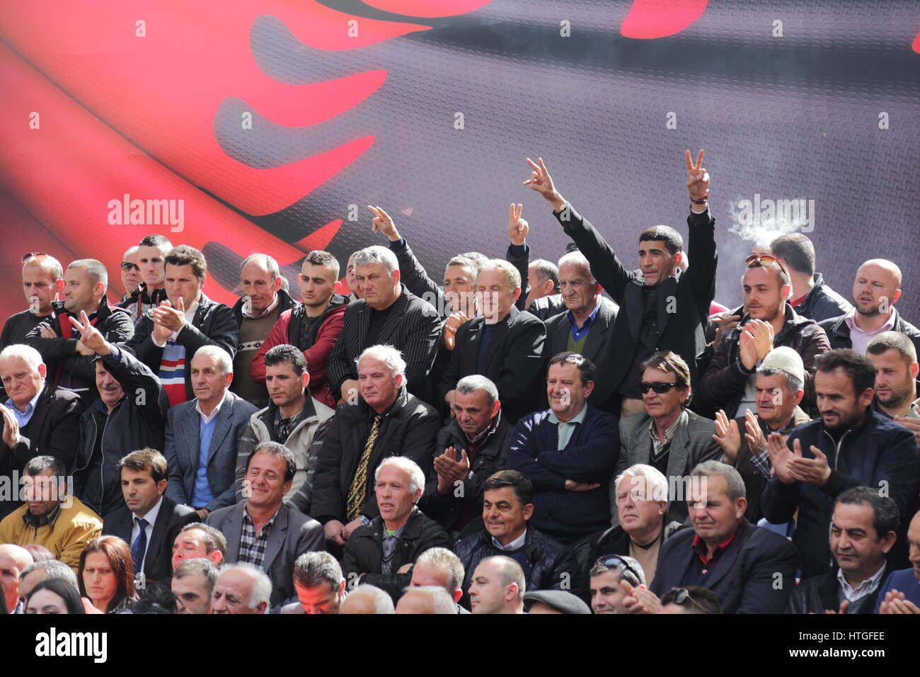 Tirana, Albania 11 March 2017. Political rally of Democratic Party of Albania in the course of election campaign 2017 in Albania: political supporters in the crowd Stock Photo