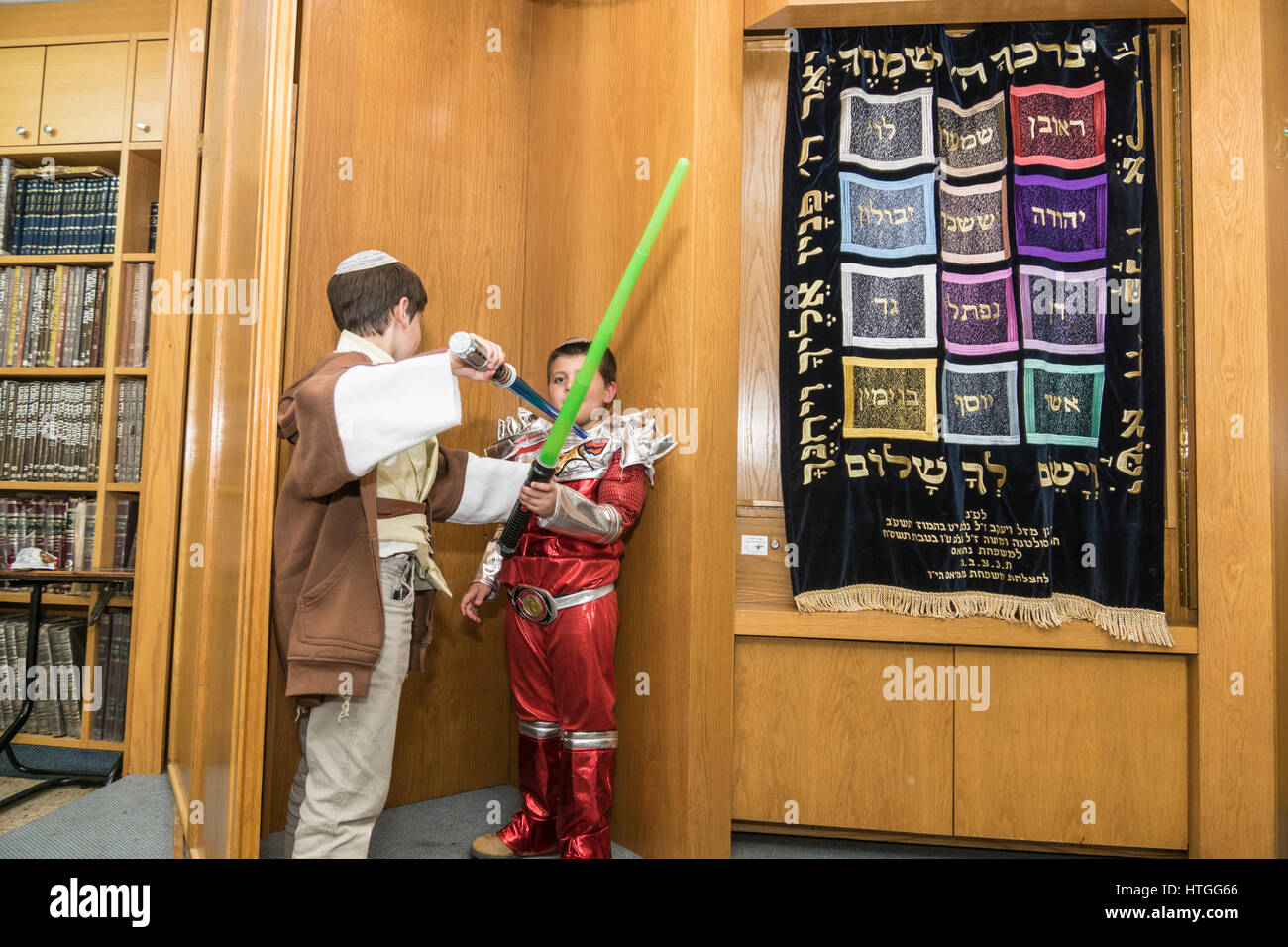 Elkana, Israel. 11th Mar, 2017. Purim holiday celebrations, Elkana, Israel. People in costumes celebrate the Jewish holiday of Purim. In this holiday Jews traditionaly dress in costumes, read the scroll of Esther, a story about an anti-jewish failed plot in ancient Persia, and make a racket whenever the name of Haman, the main antagonist, is mentioned. Credit: Yagil Henkin/Alamy Live News Stock Photo
