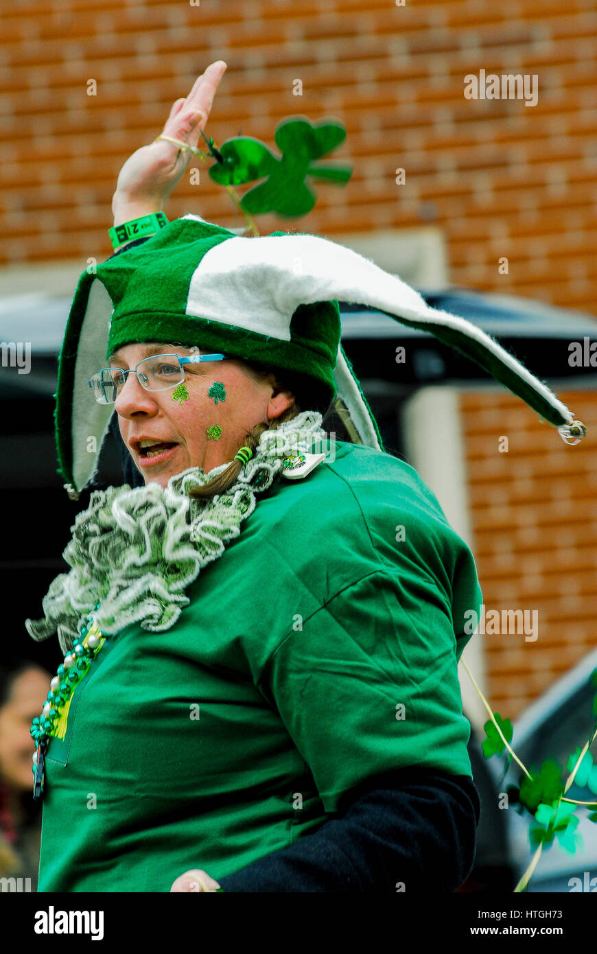 Emporia, U.S. 11th Mar, 2017. Woman in her finest Irish outfit dances along during the Saint Patrick's day parade in a rural farming community today in Emporia Kansas, March 11, 2017. Credit: mark reinstein/Alamy Live News Stock Photo