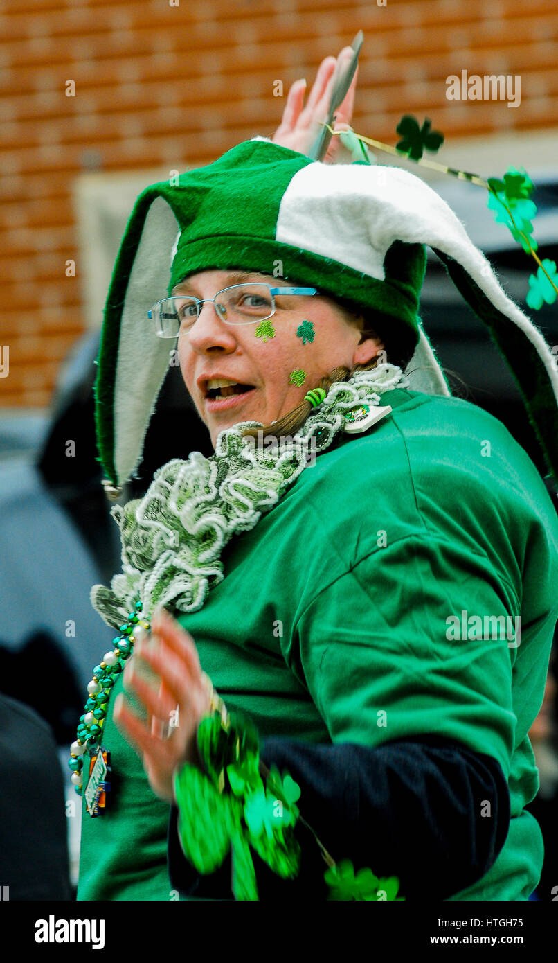 Emporia, U.S. 11th Mar, 2017. Woman in her finest Irish outfit dances along during the Saint Patrick's day parade in a rural farming community today in Emporia Kansas, March 11, 2017. Credit: mark reinstein/Alamy Live News Stock Photo
