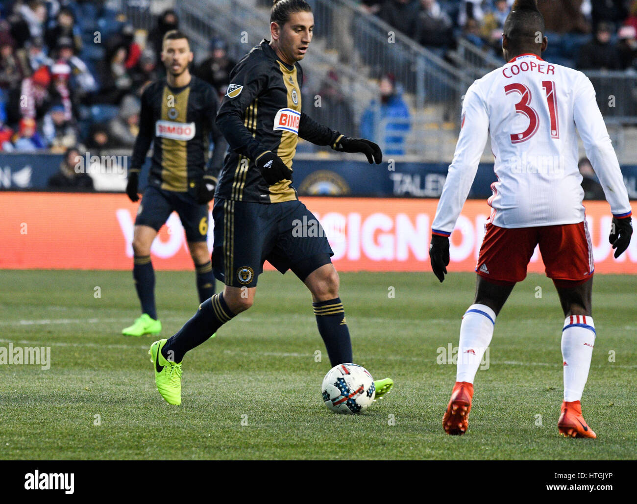 Chester, Pennsylvania, USA. 11th Mar, 2017. Toronto FC's ARMANDO COOPER, (31) fights for the ball against the Union's ALEJANDO BEDOYA, (11), during the match held at Talen Energy Stadium in Chester Pa Credit: Ricky Fitchett/ZUMA Wire/Alamy Live News Stock Photo