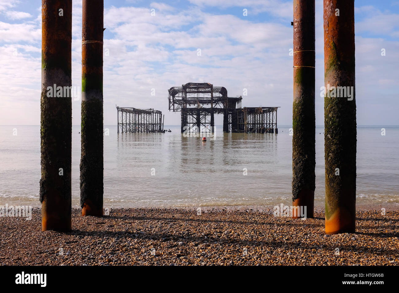 Brighton UK 15th March 2017 - The West Pier Brighton sits in a calm sea on a beautiful warm sunny Spring morning as Storm Stella approaches and is expected to arrive in Britain on Friday after causing blizzard conditions on the east coast of America in the last few days  Credit: Simon Dack/Alamy Live News Stock Photo