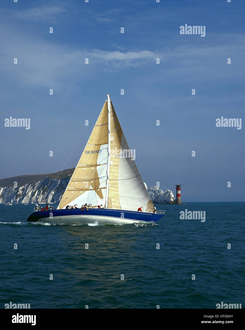 AJAXNETPHOTO. 1989. SOLENT, ENGLAND. - FASTNET RACE YACHT - THE U.S. MAXI YACHT NIRVANA PASSING THE NEEDLES LIGHTHOUSE ON THE FIRST LEG OF THE RACE TO FASTNET ROCK.   PHOTO:JONATHAN EASTLAND/AJAX  REF:890556 2 Stock Photo