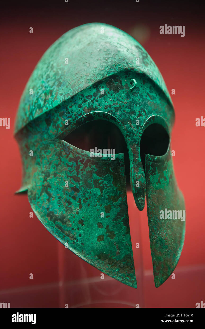 Corinthian helmet from the 5-4th century BC on display in the Staatliche Antikensammlungen (Bavarian State Collection of Antiques) in Munich, Bavaria, Germany. Stock Photo
