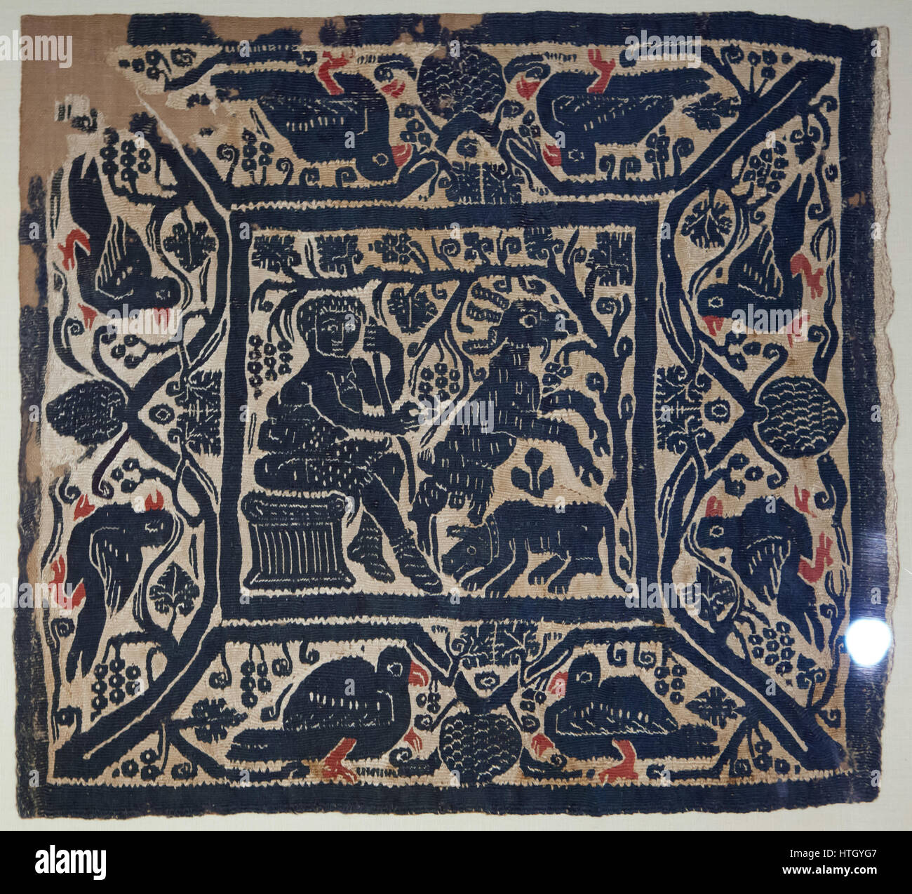 Bucolic scene framed by doves and bunches. Coptic textile from 5-6th century AD on display in the Staatliches Museum Agyptischer Kunst (State Museum of Egyptian Art) in Munich, Bavaria, Germany. Stock Photo