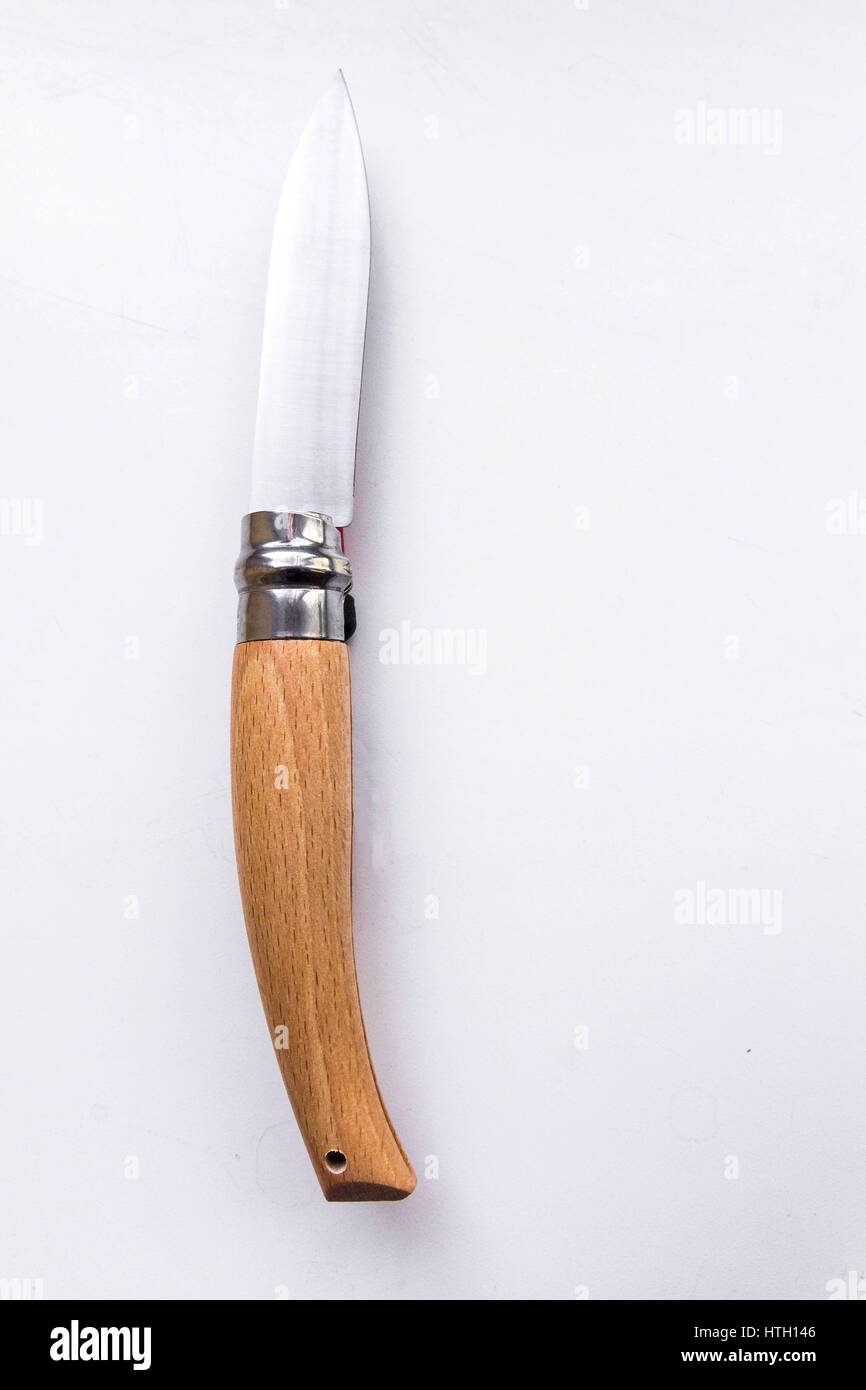 Knife with a wooden handle. Gray background. Stock Photo