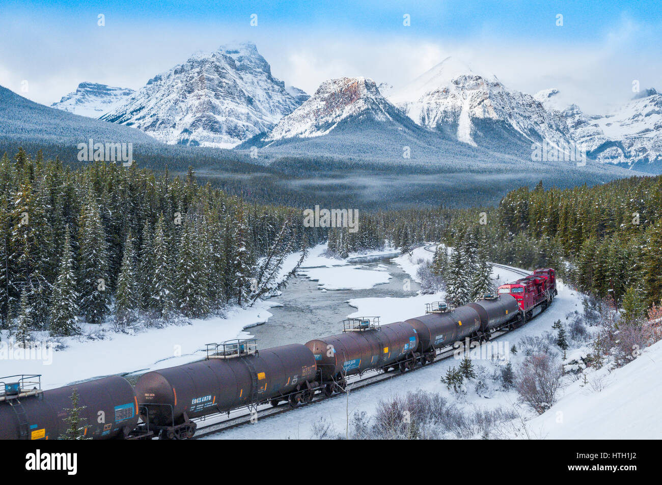 Train at Morant's curve with Haddo Peak, Saddle Mountain, Fairview Mountain in the background, Banff National Park, Alberta, Canada Stock Photo