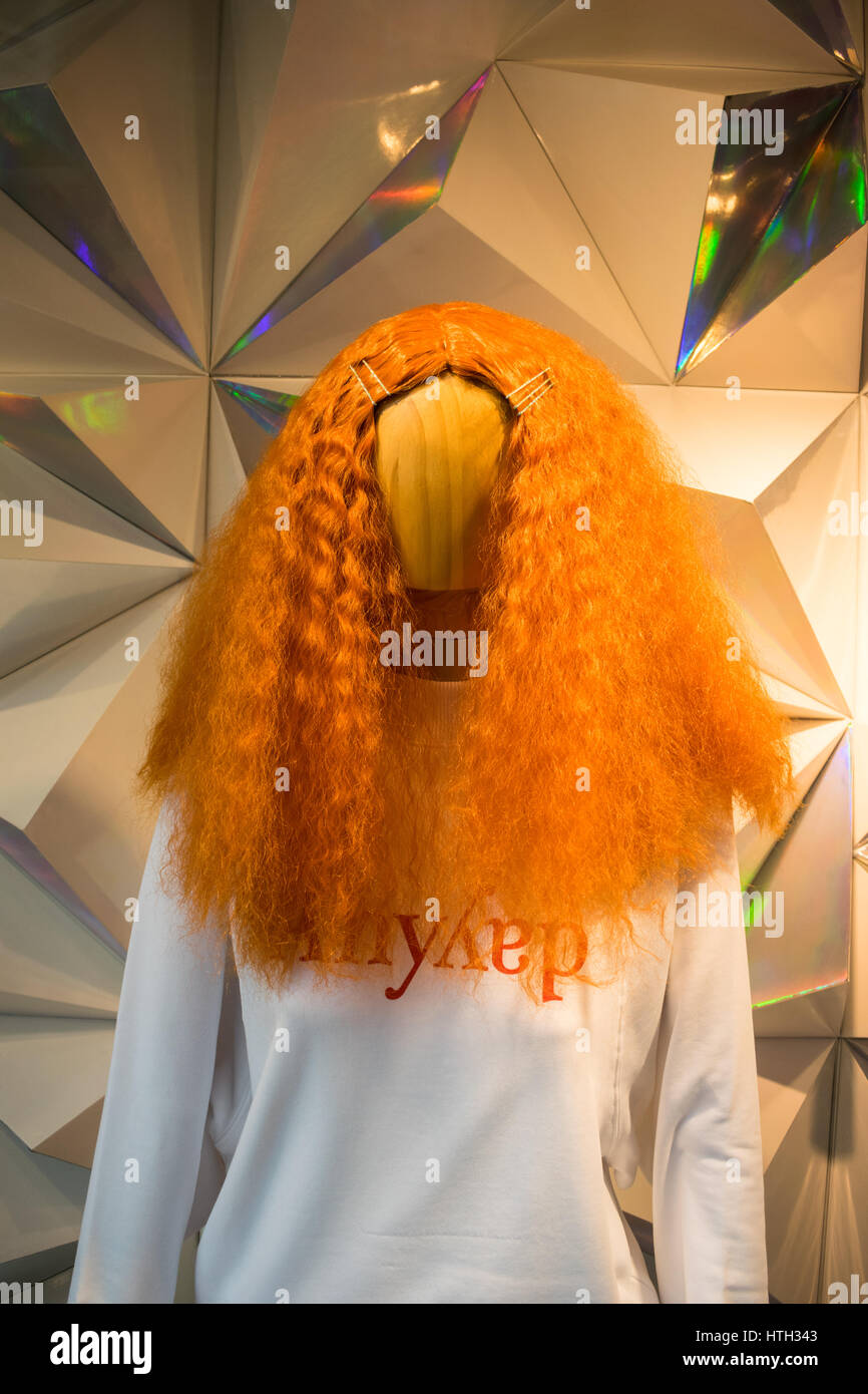 Orange haired mannequin at a clothing shop display in Hong Kong Stock Photo