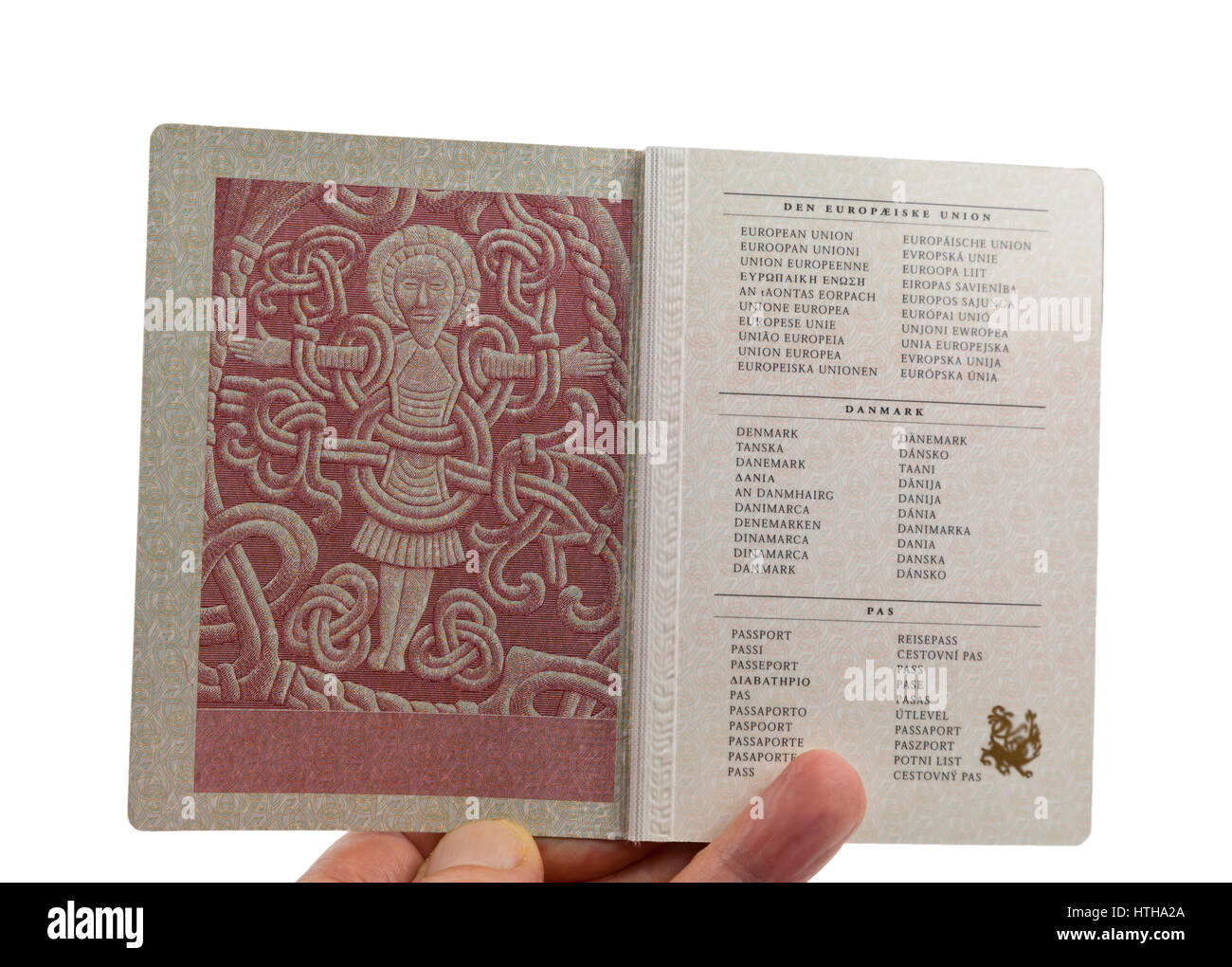 Page 2 in the Danish passport displays the figure of Christ from the Jelling rune stone raised by Viking king Harald Bluetooth in the 10th century Stock Photo