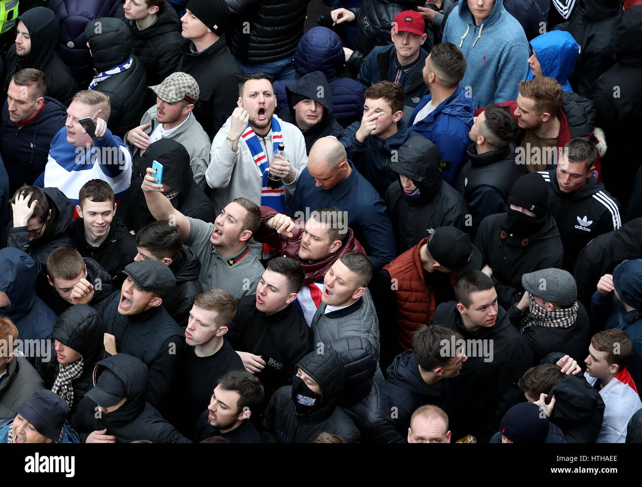 EDITORS NOTE GESTURES IN CROWD*** Rangers fans are contained by the police  on Springfield Road, near the stadium, before the Ladbrokes Scottish  Premiership match at Celtic Park, Glasgow Stock Photo - Alamy