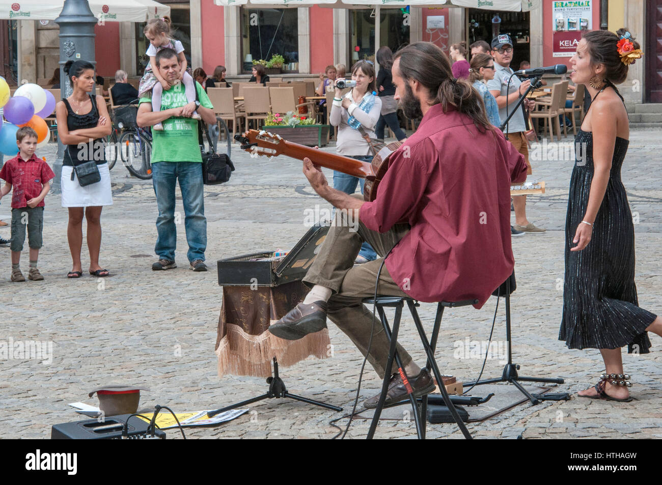 Singer and guitar player duo performing at Rynek (Market Square) in