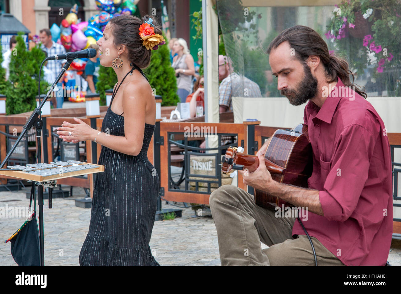 Singer and guitar player duo performing at Rynek (Market Square) in