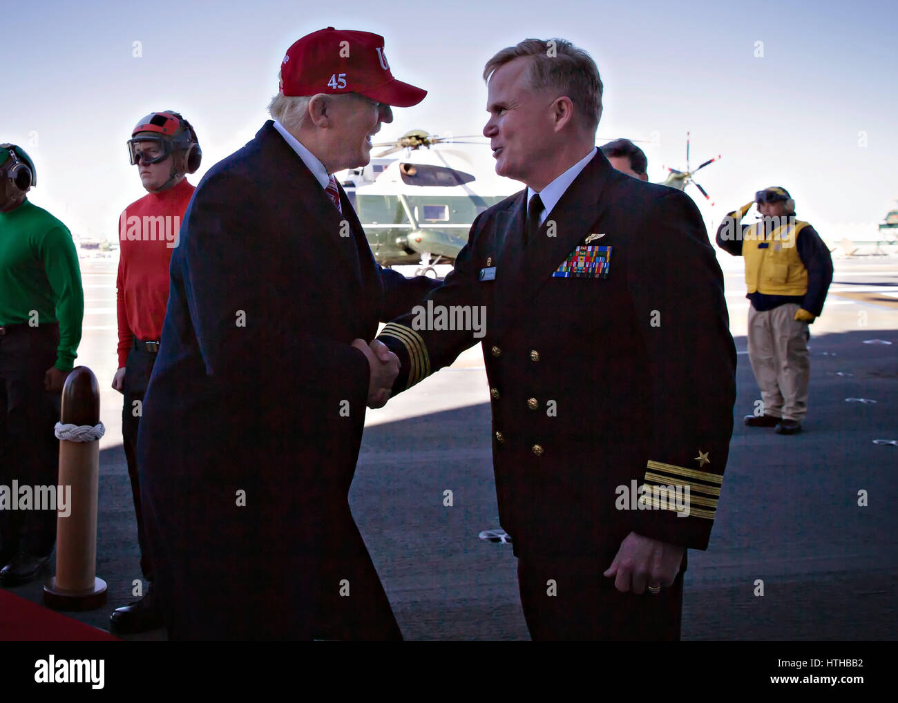 U.S. President Donald Trump is welcomed by ships Captain Rick McCormack ...