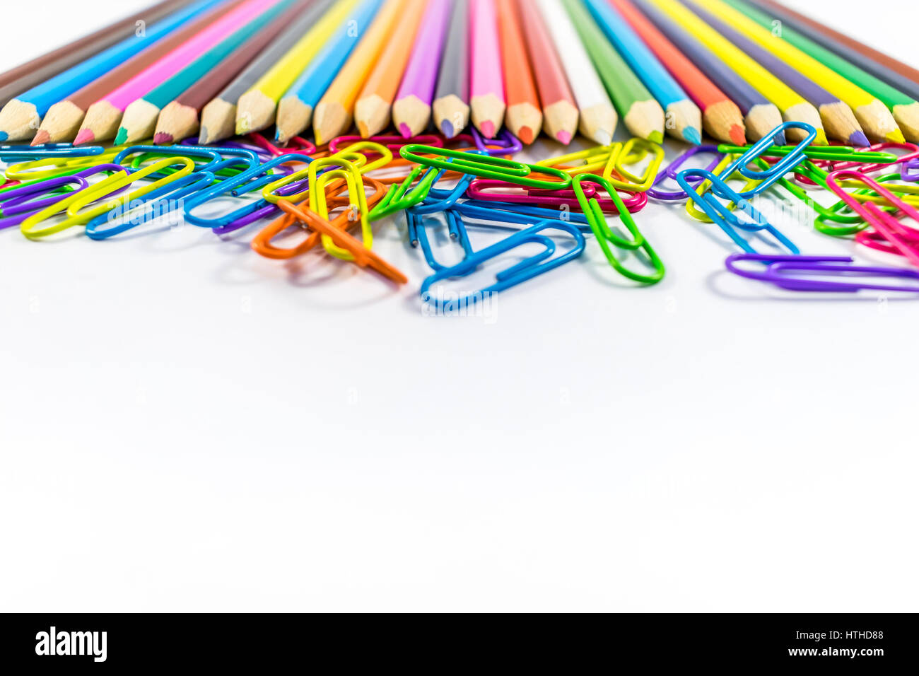 Colored pencils and paper clips Stock Photo - Alamy