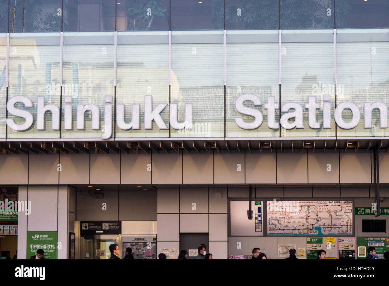 Overhead sign for Shinjuku Train Station. Stock Photo