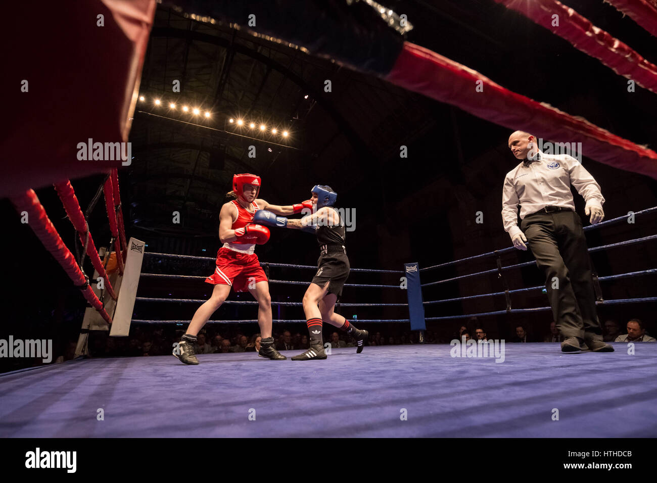 Cambridge, UK. 10th March, 2017. Lucy Harris (Red, Cambs) v Roni Dean (Thetford Town Boxing Club). Oxford vs Cambridge. 110th Boxing Varsity Match at the Cambridge Corn Exchange. © Guy Corbishley/Alamy Live News Stock Photo