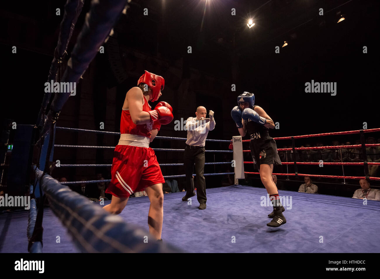 Cambridge, UK. 10th March, 2017. Lucy Harris (Red, Cambs) v Roni Dean (Thetford Town Boxing Club). Oxford vs Cambridge. 110th Boxing Varsity Match at the Cambridge Corn Exchange. © Guy Corbishley/Alamy Live News Stock Photo