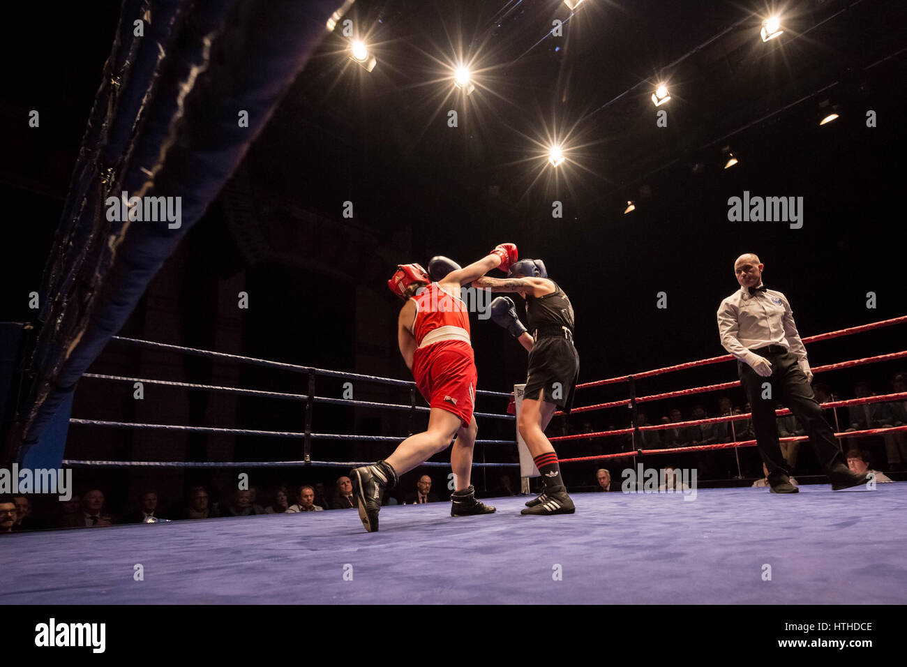 Cambridge, UK. 10th March, 2017. Lucy Harris (Red, Cambs) v Roni Dean (Thetford Town Boxing Club). Oxford vs Cambridge. 110th Boxing Varsity Match at the Cambridge Corn Exchange. © Guy Corbishley/Alamy Live News Stock Photo