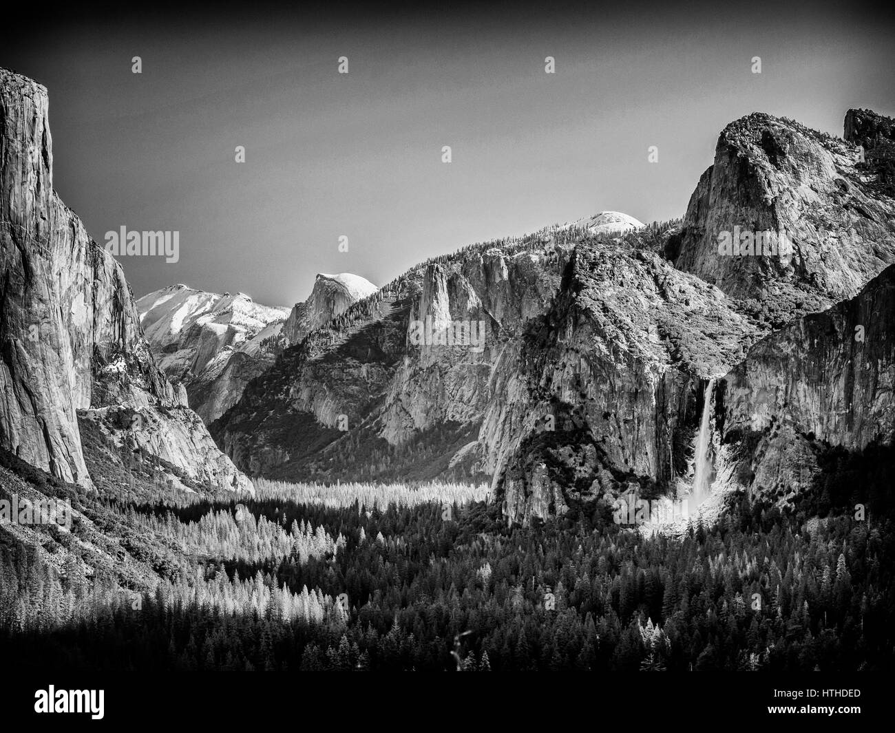 The view over the Yosemite Valley from Tunnel Viewpoint in balck and white in the style of Ansel Adams. Stock Photo