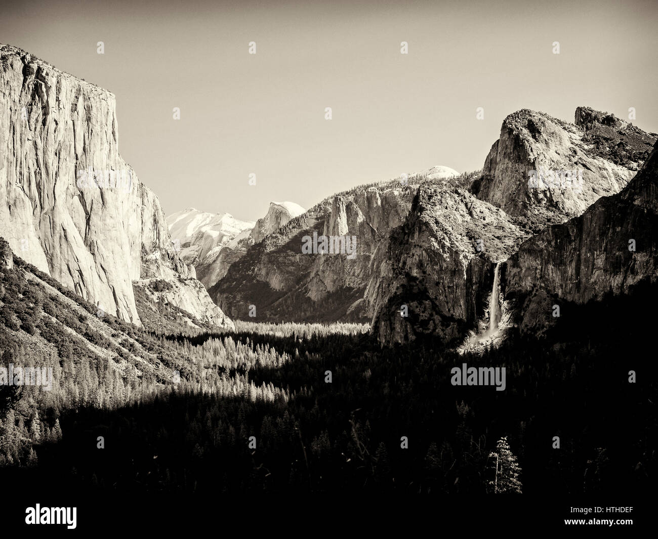 The view over the Yosemite Valley from Tunnel Viewpoint in balck and white in the style of Ansel Adams. Stock Photo